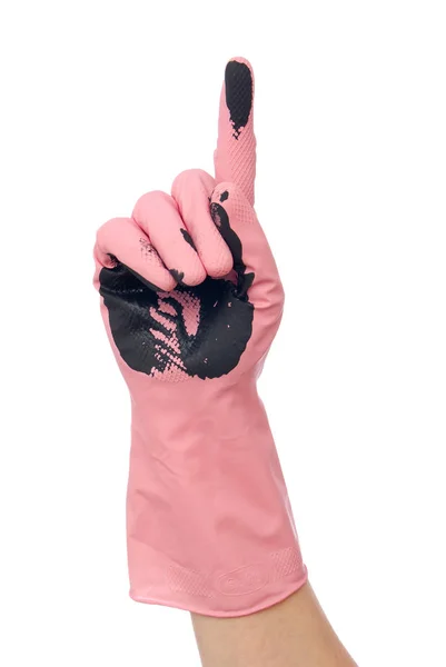Hand i smutsiga rosa handske — Stockfoto