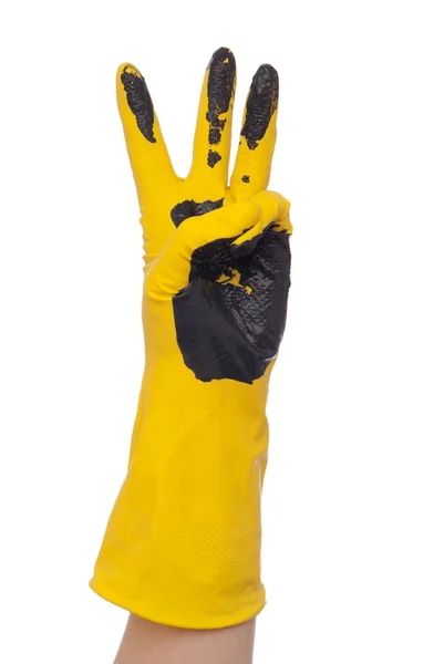 Ruku v žluté špinavé rukavice — Stock fotografie