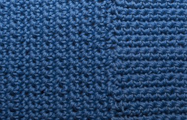 Örülmüş doku, ön yüzey. Doğal yün, klasik mavi, monokrom. Yakın plan, arkaplan