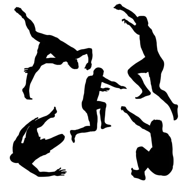 Silhouette di uomini che saltano — Vettoriale Stock