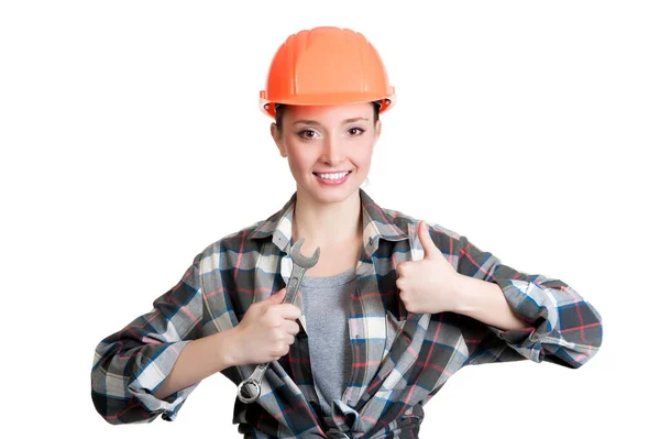 Schöne Mädchen Einem Gebäude Helm Hält Einen Schraubenschlüssel — Stockfoto