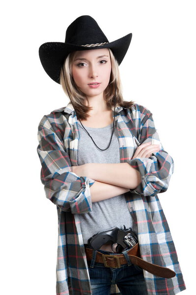 Beautiful sexy blonde girl wearing sunglasses and a cowboy hat, a gun in his belt