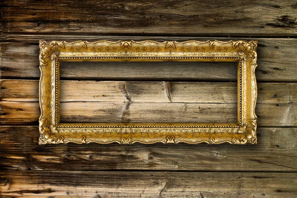 Big Old Gold Picture Frame on wooden background