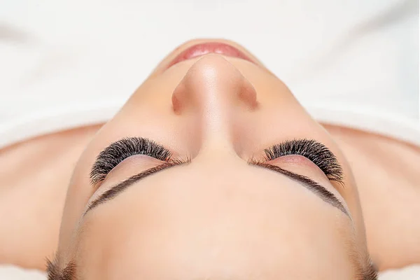 Treatment of Eyelash Extension. Lashes. Eyes with Long Eyelashes.