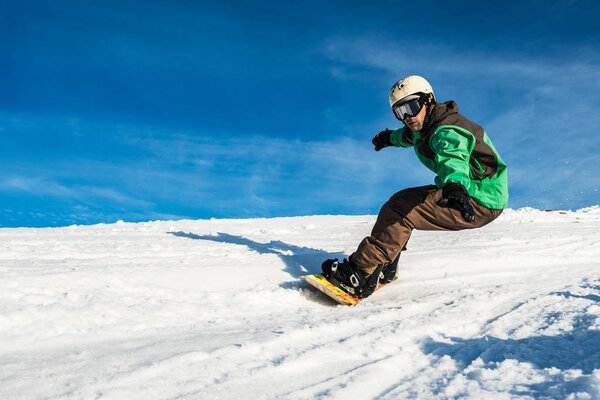 Snowboard freerider in the mountains