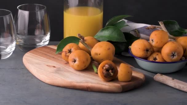 Loquats on kitchen counter — Stock Video