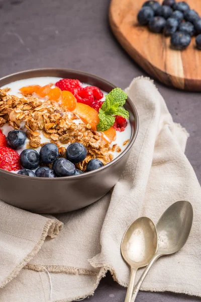 Yogurt with baked granola and berries — Stock Photo, Image