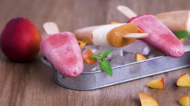 Homemade raspberries and peach popsicles Royalty Free Stock Video