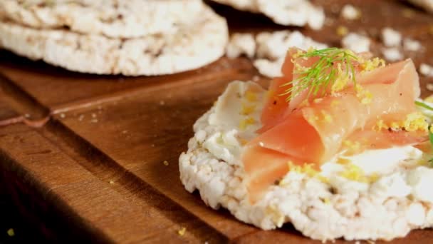 Delicious smoked salmon and cream cheese on rice bread toasts. — Stock Footage Delicious Smoked Salmon Cream Cheese Rice Bread Toasts Video Clip