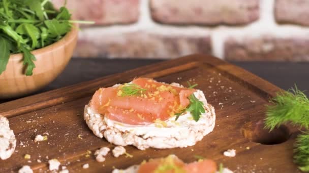 Delicious smoked salmon and cream cheese on rice bread toasts. — Stock Footage Delicious Smoked Salmon Cream Cheese Rice Bread Toasts Stock Video