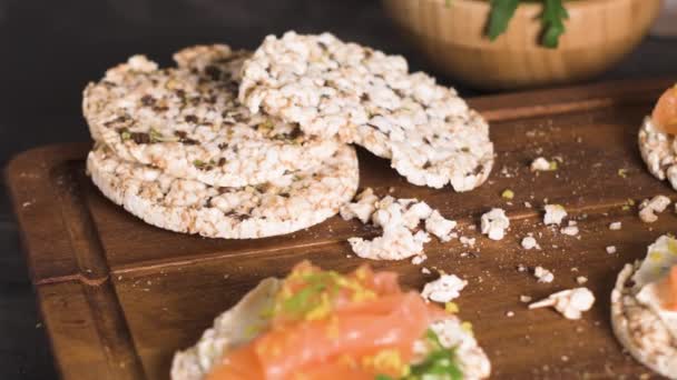 Delicious smoked salmon and cream cheese on rice bread toasts. — Stock Footage Delicious Smoked Salmon Cream Cheese Rice Bread Toasts Stock Video