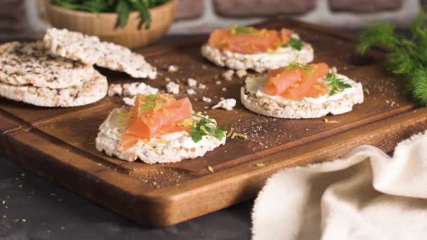Delicious smoked salmon and cream cheese on rice bread toasts. — Stock Footage Delicious Smoked Salmon Cream Cheese Rice Bread Toasts Stock Footage