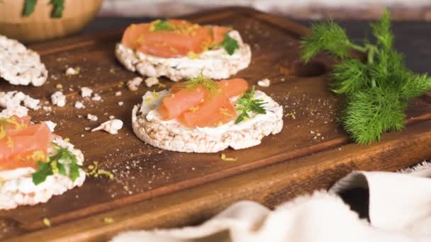 Delicious smoked salmon and cream cheese on rice bread toasts. — Stock Footage Delicious Smoked Salmon Cream Cheese Rice Bread Toasts Stock Footage