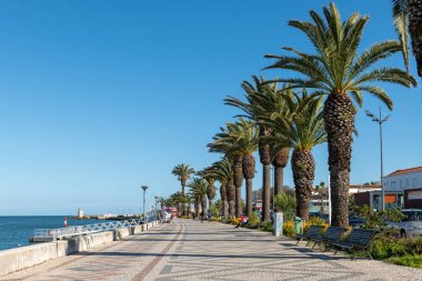 LAGOS, PORTUGAL - CIRCA MAY 2018: Avenida dos Descobrimentos with tourists walking, Lagos, Algarve, Portugal,