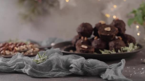 Dark Chocolate Truffles Hazelnuts Chopped Hazelnuts Wooden Cutting Board — Stock Video