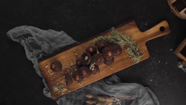 Dark Chocolate Truffles Hazelnuts Wooden Cutting Board — Stock Video