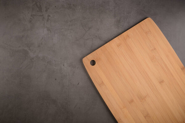 Top view of wooden cutting board on old stone countop
.