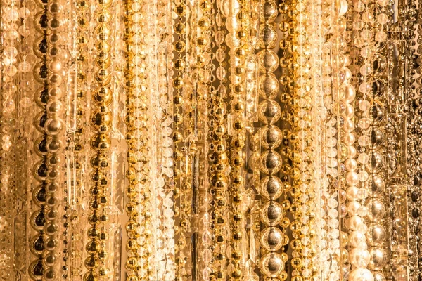 Texture from strings of various gold beads