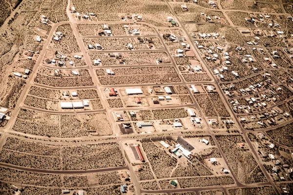 Aerial photography over Nevada Mojave desert with roads and town