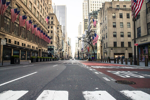 NEW YORK CITY, USA - APRIL 18, 2020: Empty streets in midtown Manhattan, in New York City along Fifth Avenue during the global Covid-19 Coronavirus Crisis.