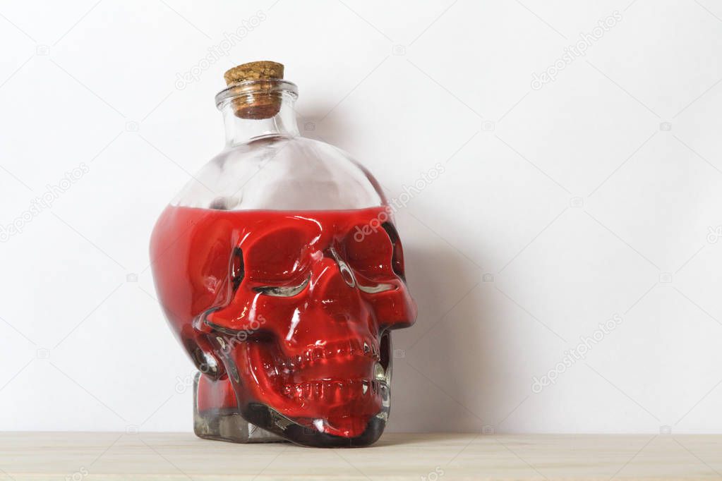 Human skull containing blood or poison