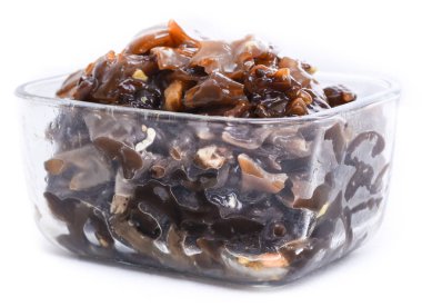 Chinese pickled muer mushroom in a glass container clipart