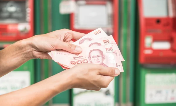Closeup of woman's hand holding cash withdrawn from ATM — Stock Photo, Image