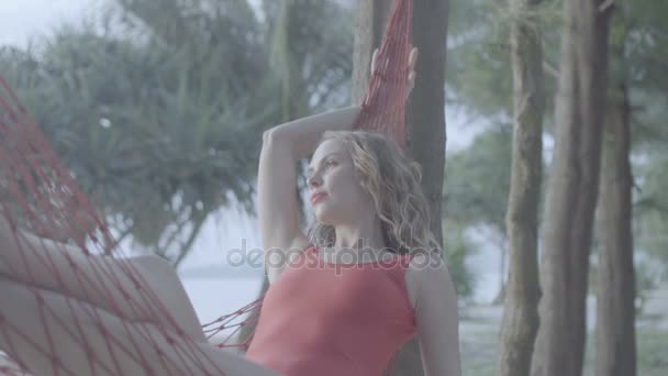 Woman on the hammock at the beach — Stock Video