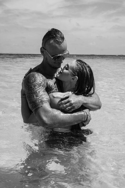 Attractive young couple in the sea