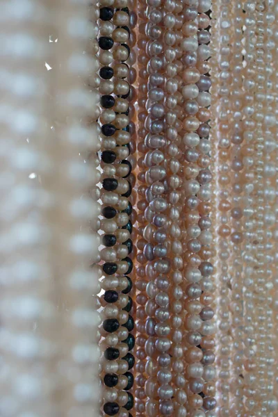 Multicolored pearls on the market — Stock Photo, Image