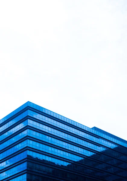 Mirrored building against cloudy sky background — Stock Photo, Image