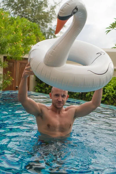 Handsome man in the pool — Stock Photo, Image