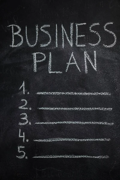 Lista de planes de negocio en pizarra negra — Foto de Stock