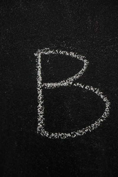 Letter B on black chalkboard — Stock Photo, Image