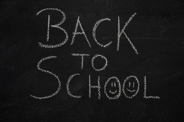 Back to school text on black chalkboard