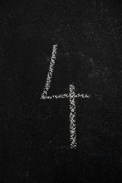 Number 4, four on black chalkboard — Stock Photo, Image