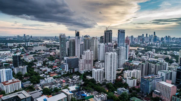 Modern city during beautiful cloudy sunset — Stock Photo, Image