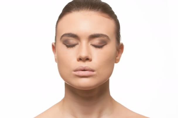 Time lapse sequence of makeup being applied to the model's face — Stock Video