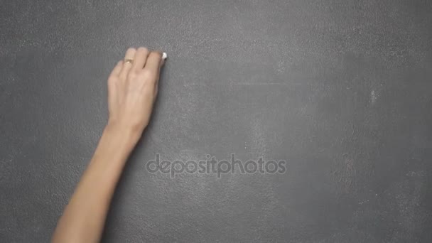 Hand writing EUR, GBP, USD and Bitcoin currency symbols on black chalkboard — Stock Video