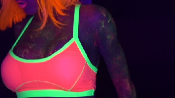 Sexy woman with UV fluorescent face and body makeup — Stock Video