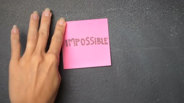 Sticky Note Blackboard Closeup Woman Hand Sticking Note Impossible Possible — Stock Video