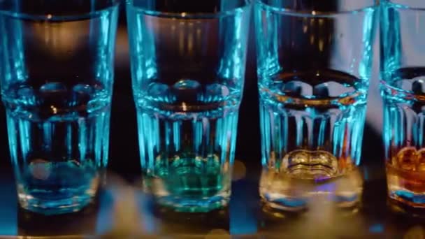 Slow Motion Pan Glasses Different Colors Spirits Bar Night Club — Stock Video