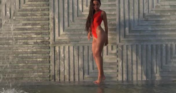 Beautiful Brunette Woman Red Swimsuit Posing Outdoor Pool Wall Waterfall — Stock Video