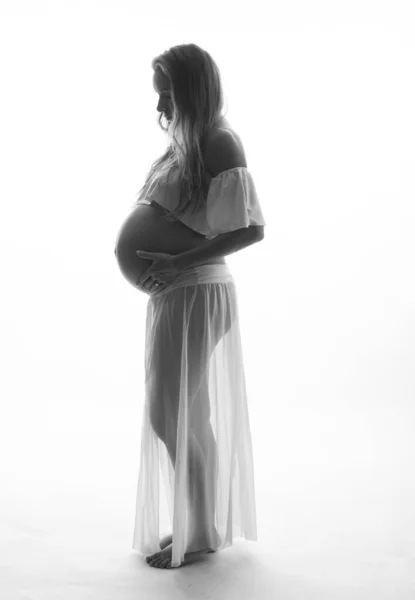 Pretty Pregnant Woman Touching Her Belly While Standing White Background — Stock Photo, Image