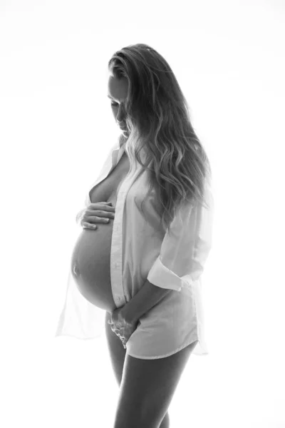 Pretty Pregnant Woman White Shirt Panties Holding Her Belly While — Stock Photo, Image