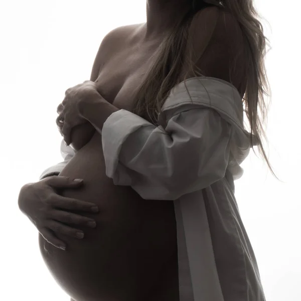 Closeup Pregnant Woman Shirt Holding Her Belly While Standing White — Stock Photo, Image