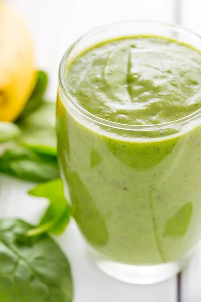 Absolutely Amazing Tasty Green Avocado Shake or Smoothie, Made with Fresh Avocados, Banana, Lemon Juice and Non Dairy Milk (Almond or Coconut) on Light White Wooden Background, Raw Food, Vegan Drink, Vegan Food Conception, Vertical View, Close-up
