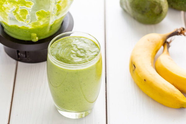 Absolutely Amazing Tasty Green Avocado Shake or Smoothie, Made with Fresh Avocados, Banana, Lemon Juice and Non Dairy Milk (Almond or Coconut) on Light White Wooden Background, Raw Food, Vegan Drink, Vegan Food Conception, Horizontal View