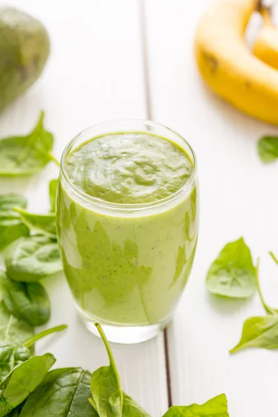 Absolutely Amazing Green Avocado Smoothie, Made with Fresh Avocados, Banana, Lemon Juice and Non Dairy Almond Milk on Light White Wooden Background, Raw, Vegan Drink Conception, Vertical View — Stock Photo, Image