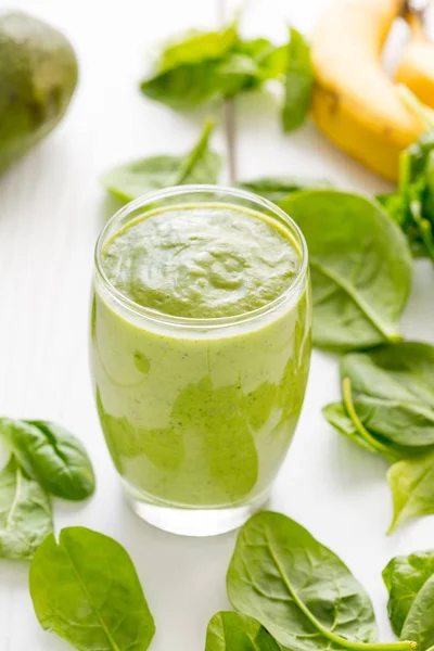 Absolutely Amazing Green Avocado Smoothie, Made with Fresh Avocados, Banana, Lemon Juice and Non Dairy Almond Milk on Light White Wooden Background, Raw, Vegan Drink Conception, Vertical View — Stock Photo, Image